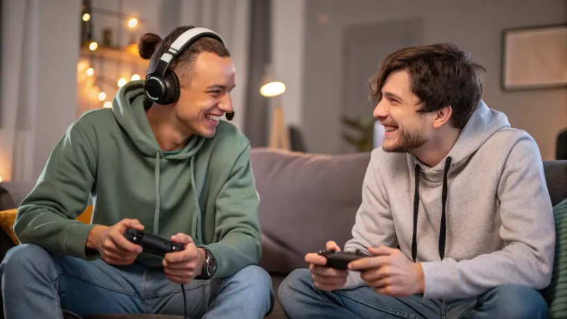 Two gamers having a friendly conversation while playing together online